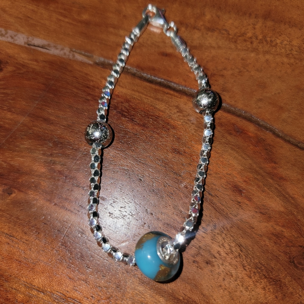 Silver bracelet with blue and silver beads